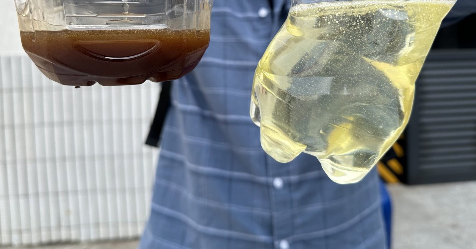 Side-by-side comparison of used and fresh compressor oil samples