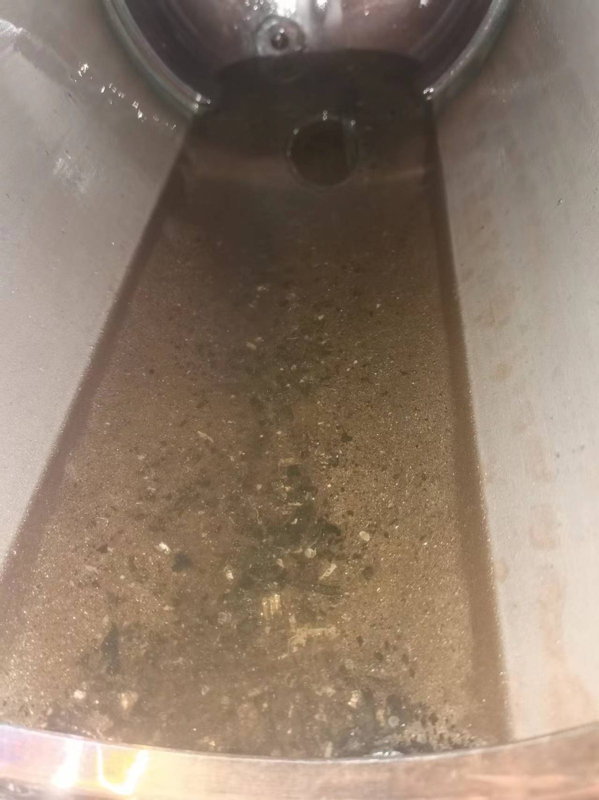 Interior of an oil strainer showing sediment and impurities